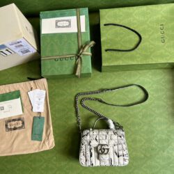 Minibolso GG Marmont de asa superior de pitón Gucci